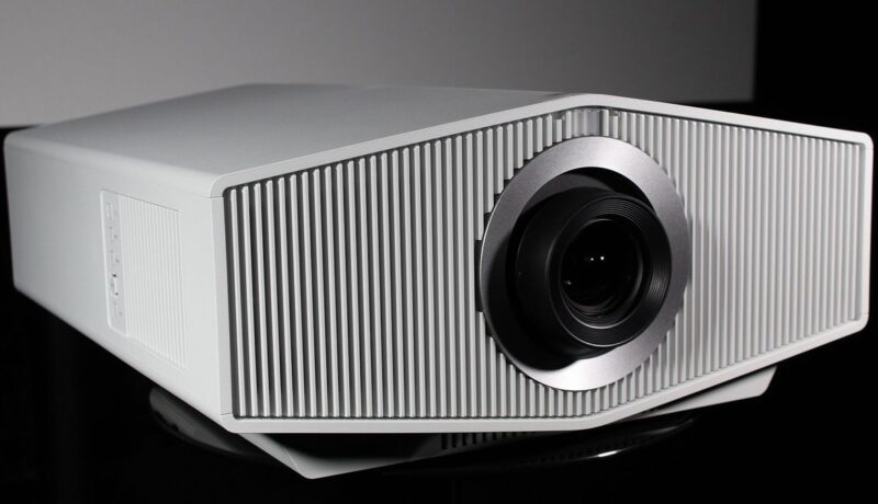 a white projector with a black lens