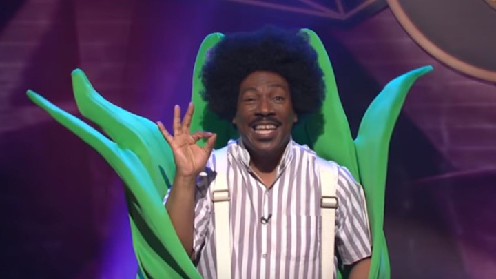 Eddie Murphy dressed as gumby giving an OK sign with his fingers and smiling when reprising the role in 2019 on Saturday Night Live.